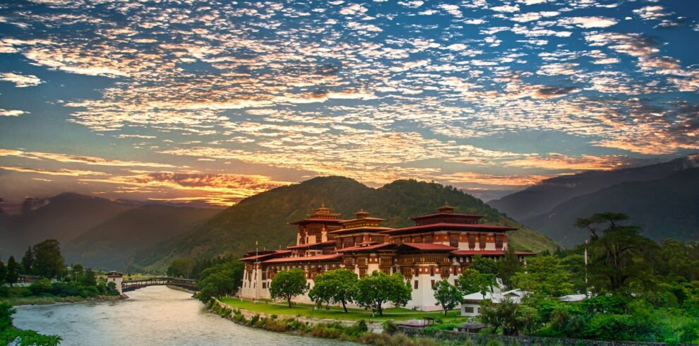 feature-bhutan-punakha-dzong-sunset-1326288165-website-1920×1080-fill-gravityauto-min